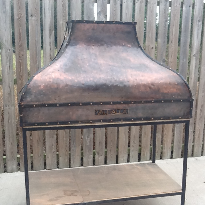 Cooker hood with copper patination
